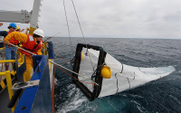 A midwater trawl net is used to collect juvenile fishes